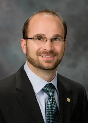 Portrait of Dr. Brian B. Nový, Chief Dental Officer, highlighting his expertise and endorsement of the SillHa Oral Wellness System by ARKRAY USA, Inc." Title: "Dr. Brian B. Nový Endorses the SillHa Oral Wellness System" Image Description: "Dr. Brian B. Nový, Chief Dental Officer at Alliance Dental Center in Quincy, Massachusetts, shares his endorsement of the SillHa Oral Wellness System by ARKRAY USA, Inc. He highlights how the system provides an objective method to quantify patients’ oral health, complements traditional dentistry, and supports molecular-level patient insights. A leader in the dental field, Dr. Nový has received numerous accolades, including the ADA Adult Preventive Care Practice of the Year, and serves as a pioneer in advancing dental practices with innovative technology.